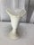 Lovey white two-tone fan shaped ceramic vase. A colorful arrangement of flowers will standout with the color palette, but...