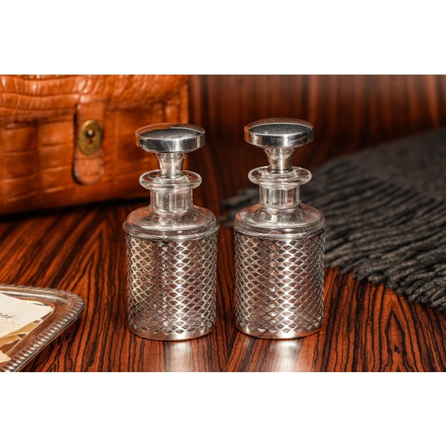 Elevate your space with this exquisite pair of matched antique dresser scent bottles, a luxurious blend of early 20th-...