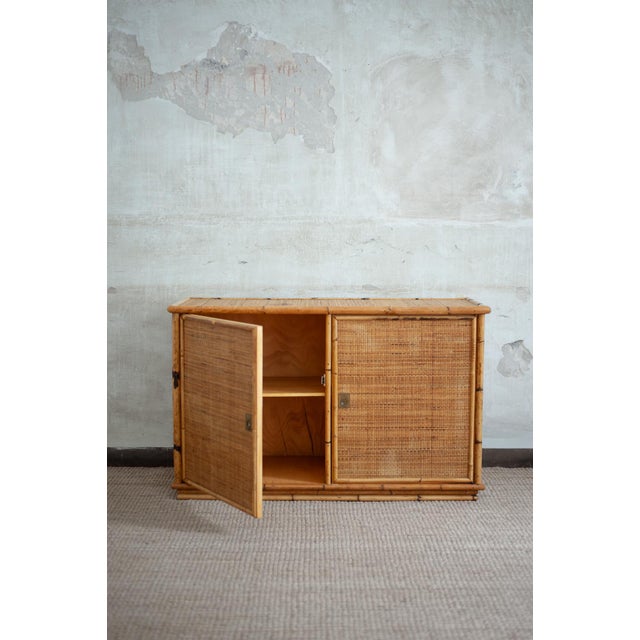 Bamboo and Rush Fabric Sideboard By Dal Vera – 1970s Product details Bamboo structure covered in rush fabric. Brass...