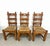 Set of six French oak dining chairs featuring tall backs and hand-woven rush seats.
