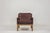 Elegant armchair designed by Kai Lyngfeldt Larsen in the 1960s. The armchair has a solid rosewood frame upholstered in...