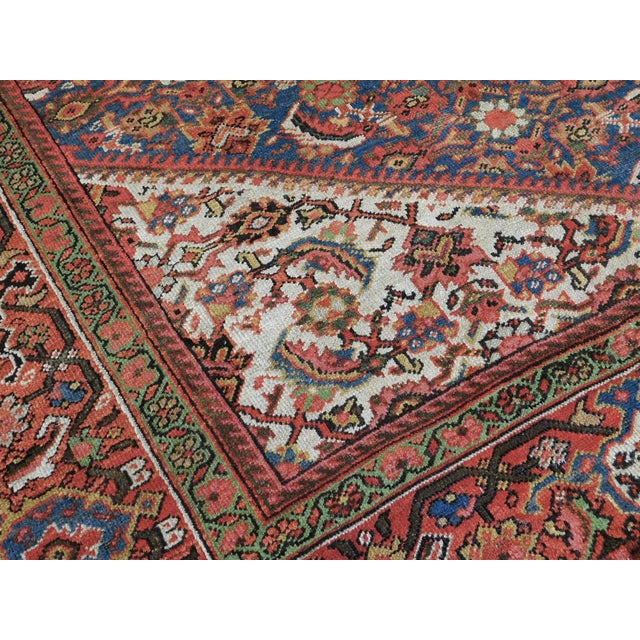 Allover Herati pattern on a blue field in various tones. Ivory spandrels. Rusty border displaying turtle motif. Vegetable...