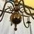 1900 brass metal chandelier at height: 70 width: 60. This piece is attributed to the mentioned designer/maker. It has no...