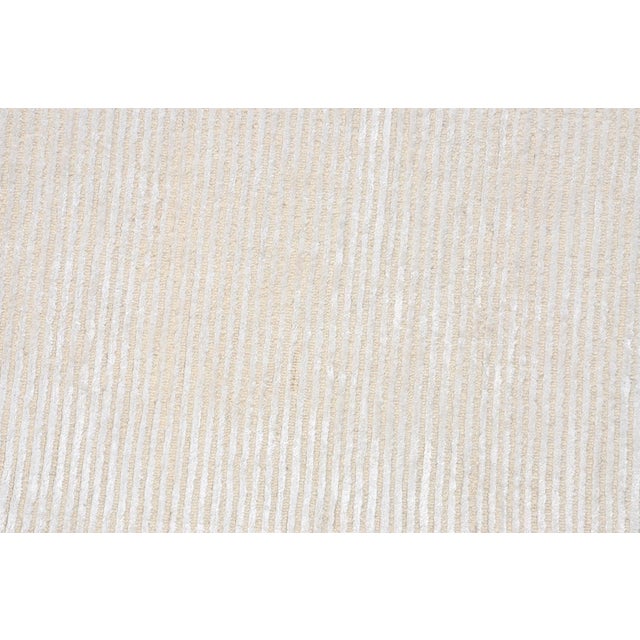 Add a touch of modern elegance to your home with Pasargad Home's Edgy Hand-Tufted bamboo Silk & Wool Area Rug. Made of...