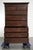 This antique English chest of drawers dates from the 18th century and is made of oak. The cabinet features intarsia inlay,...