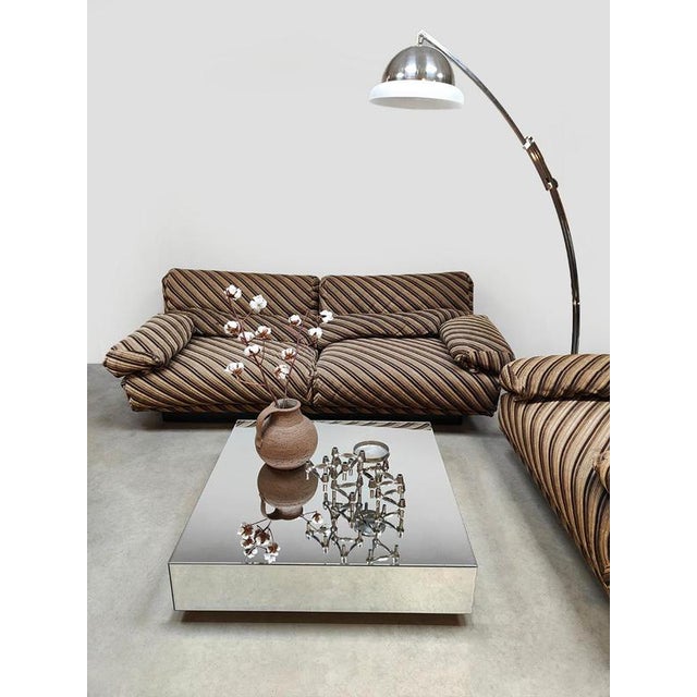 This unique vintage "Duo-tone" striped 2-seater lounge sofa with matching spacious lounge armchair has a relaxed, casual...