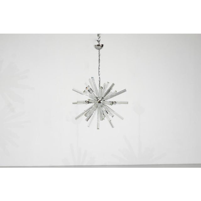 Sputnik-style pendant light with a chromed metal frame and hand-blown crystal spokes of two different lengths, 1970s...