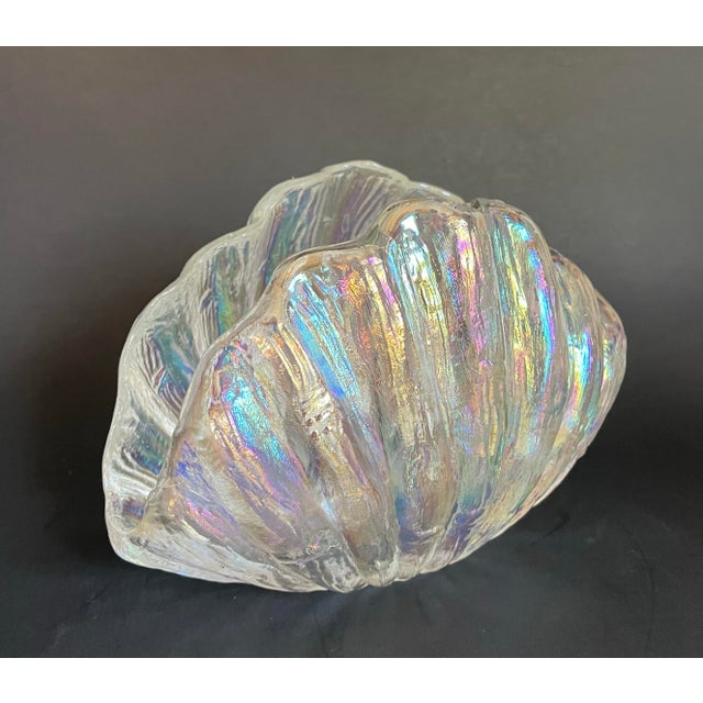 Here is a vintage iridescent glass shell napkin holder, likely dating to the mid-to-late 20th century. Formed in a...