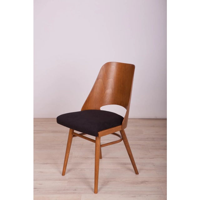 This is a set of 4 Lollipop dining chairs manufactured by Tatra in former Czechoslovakia, The wooden elements have been...