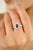 Crafted in luminous 14k white gold, this exquisite ring showcases a richly hued 0.95-carat sapphire at its center, cut in...