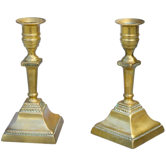 Impressive and heavy Late 19th Century Italian pair of candlesticks, elegantly handcrafted from solid brass, in a...
