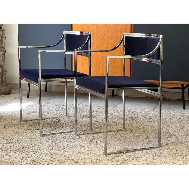 Pair of armchairs with structure in polished stainless steel and blue velvet 1970. Structure in very good condition, no...