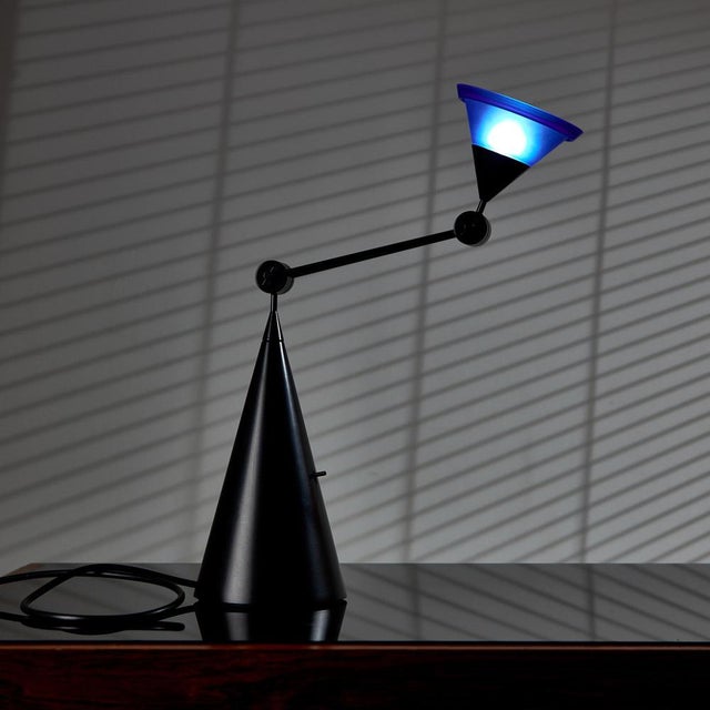 A true italian postmodern piece from the 1980s. ‘magamagó tavolo’ table lamp with blue glass shade designed by g....