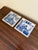 A classic pair of Dutch Delft-style hand painted blue and white porcelain tiles featuring medical scenes of an herbalist...