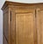 An elegant Vintage French Louis wardrobe crafted from oak, featuring a refined four door design with softly shaped panels,...