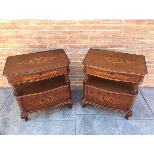 About 20th century pair of Catalan, Spanish nightstands with marquetry drawers and open shelf Two doors in the low space...