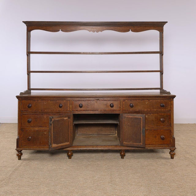 A beautiful antique oak Welsh dresser with wonderful warmth, character, and age throughout. The substantial base offers an...