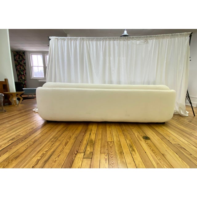 Kravet Jackson sofa featuring a recessed base in ebony finish. Clean-lined design with generous proportions and...