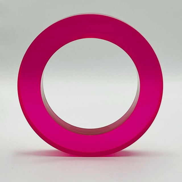 Vintage translucent pink lucite bangle with modern, geometric form. Easily stacked or worn as a stand alone statement...