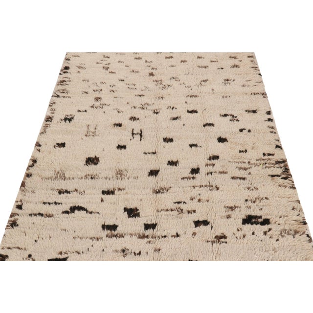 Handwoven in wool and originating from Morocco circa 1950-1960, this 4x8 vintage runner rug is a rare and among the most...