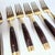 Midcentury Rosewood and Brass Salad Forks- Set of Twelve For Sale - Image 11 of 11