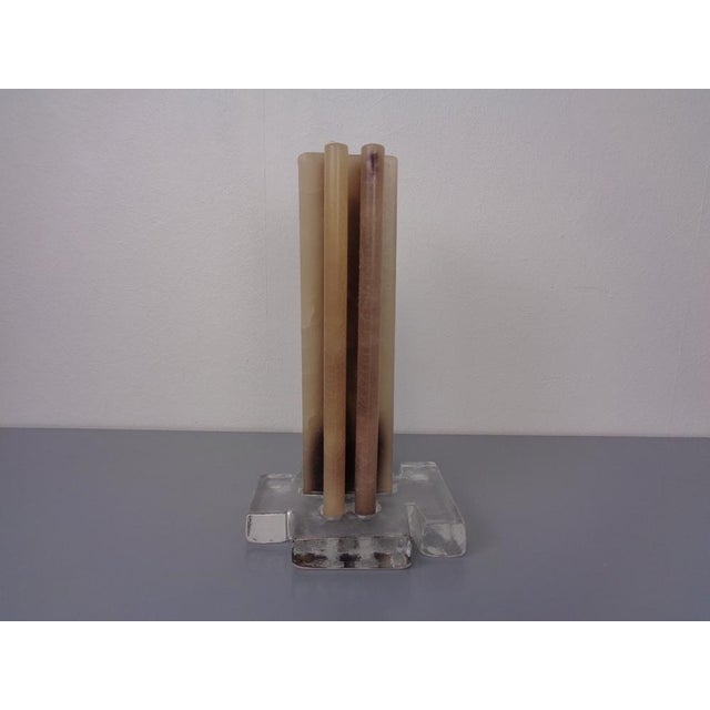 Scandinavian candlestick made of ice glass with the original candle from the 1960s.