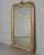 A 19th century French Louis Philippe Period gilded mirror. Unusual form with gently rounded top corners and distinct...