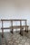 Pair of large antique wooden church pews, with straight backs and simple legs typical of chapel furniture. Their simple...