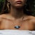 The Energy Anchor Evil Eye Pendant Necklace is a captivating blend of artisanal craftsmanship, symbolic protection, and...