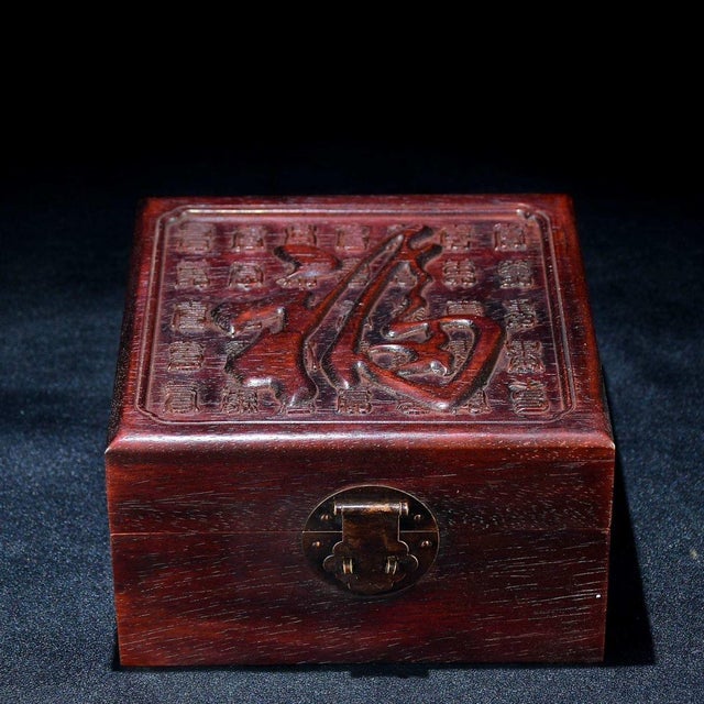 This is a beautiful vintage Chinese carved wooden jewelry or keepsake box. The lid features an intricate, high-relief...