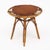 Side table from Vallauris, France made of bamboo. There is a circular wood top with a curved bamboo structure. This piece...