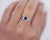 1.04 Carat Sapphire and Round Cut Diamond in Filigree Platinum Ring. The ring hold a beautiful, eye-captivating, prong-...