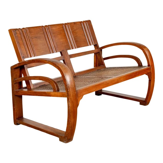 Teak Wood Settee from Madura with Folding Back, Looping Arms and Cane Seat For Sale