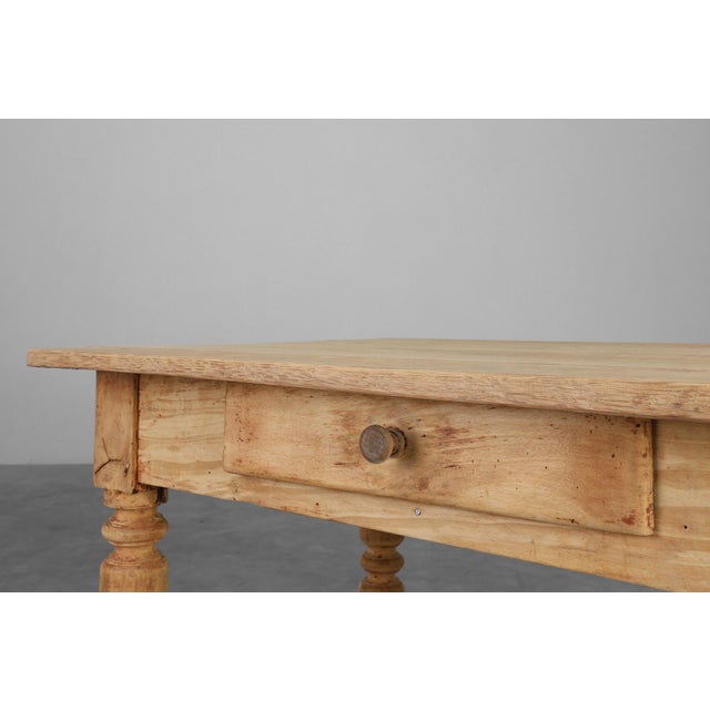 France / 1850 / Side Table / beech / Rustic / French Provincial / Antique This charming 19th-century side table from the...