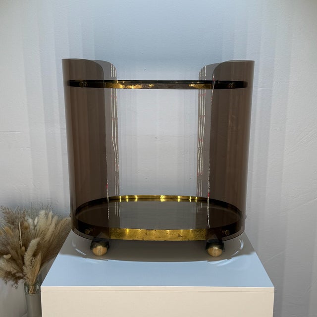 This elegant serving cart is a prime example of late 1960s Italian design. Its striking oval shape and combination of...