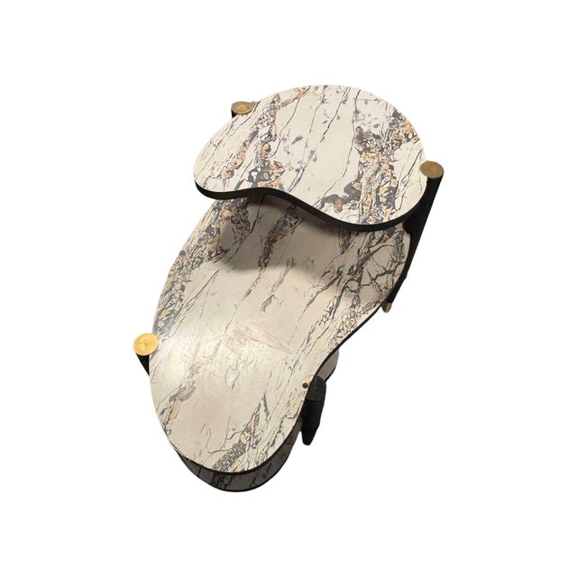 Fabulous original 1950s biomorphic three-tier Mid-Century side table. The table features marbleized white Formica top and...