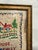 This vintage framed cross stitch wall art features a charming small house with the heartfelt quote, "Dear house, you are...