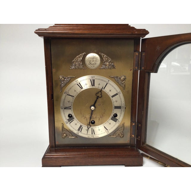 Elegant English bracket clock with mahogany case. Well made and chimes on every quarter hour with either Westminster or...