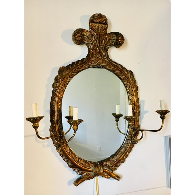 Vintage John Richard Carved and Gilt Oval Mirror With Double Sconces