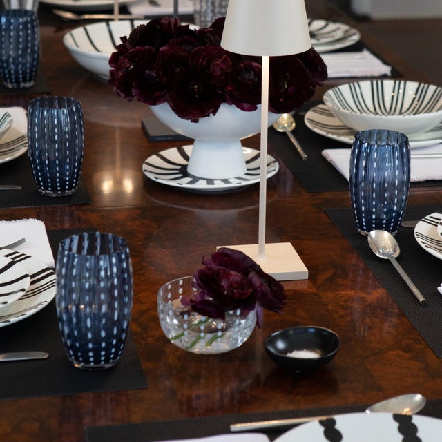 Collection for the table in clear colored glass. It includes tumblers for water and soft drinks, wine glasses, flute...