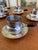 Charming vintage set of six silver-plated espresso cups with matching saucers, featuring elegant dark bakelite handles...