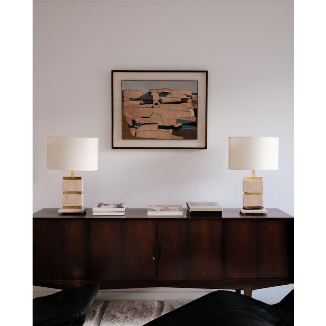 Crafted in Italy in the 1970s, this pair of table lamps transcends mere function to become illuminated sculpture. Each...