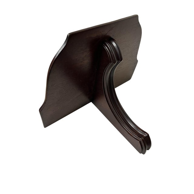 Vintage decorative wall bracket in dark brown wood finish. Has a large display area . Measures 10” w x 7” d x 7” h.