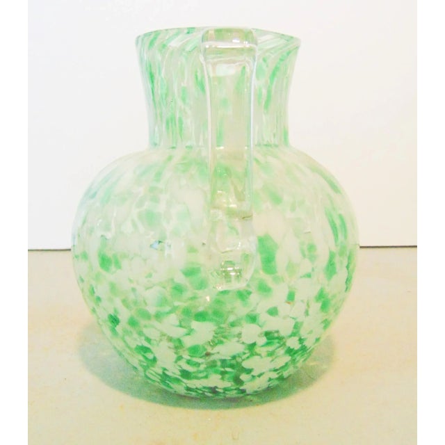 Art Glass Speckled Water Pitcher, green and white speckles, with clear glass handle.