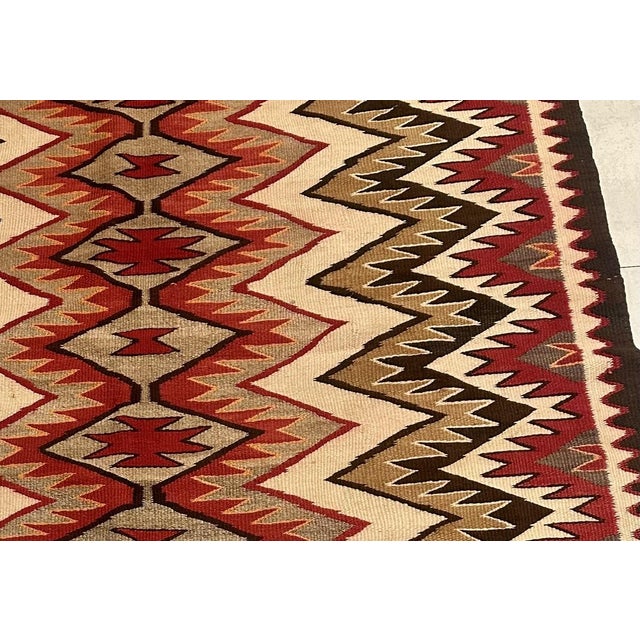 Discover the Beauty of Native American Craftsmanship in Antique 1880s Navajo Style Handmade Wool Rug Experience the...