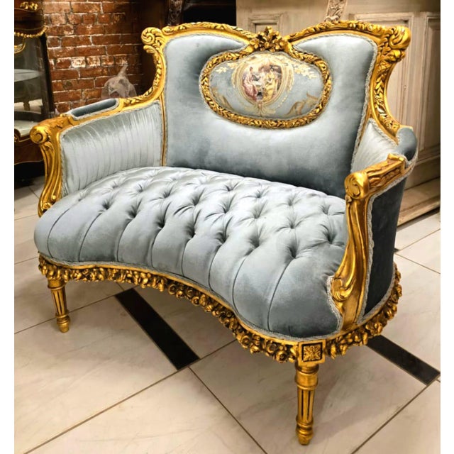 Bring timeless romance into your home with this breathtaking French Louis XV loveseat sofa, upholstered in sumptuous sky...