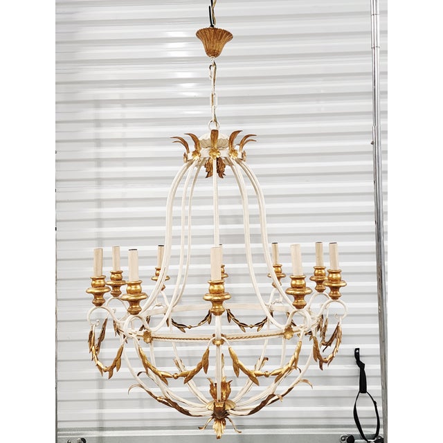 Stunning large French Neoclassical style balloon form chandelier with 10 lights. Featuring a painted frame in an antique...