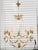 Stunning large French Neoclassical style balloon form chandelier with 10 lights. Featuring a painted frame in an antique...