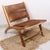 Our Natural Teak and Genuine Leather Chair is a masterpiece of artisanal craftsmanship, featuring a solid Teak wood frame...
