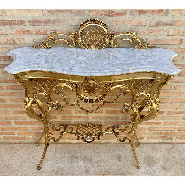 This striking Italian console table dates from the 1960s and showcases the exuberant decorative language characteristic of...